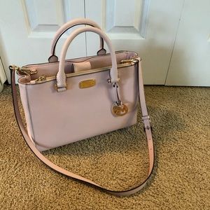 A medium sized michael kors bag.